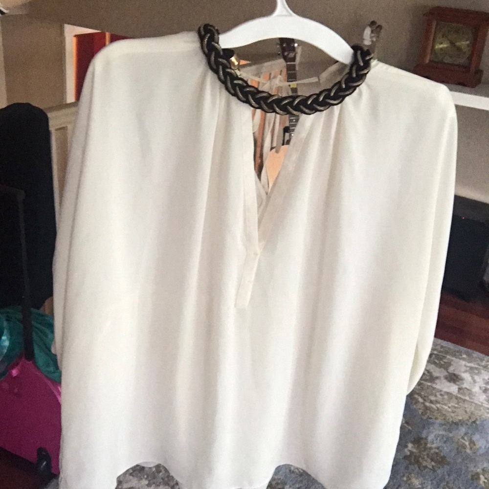 Zara top with a black and gold collar